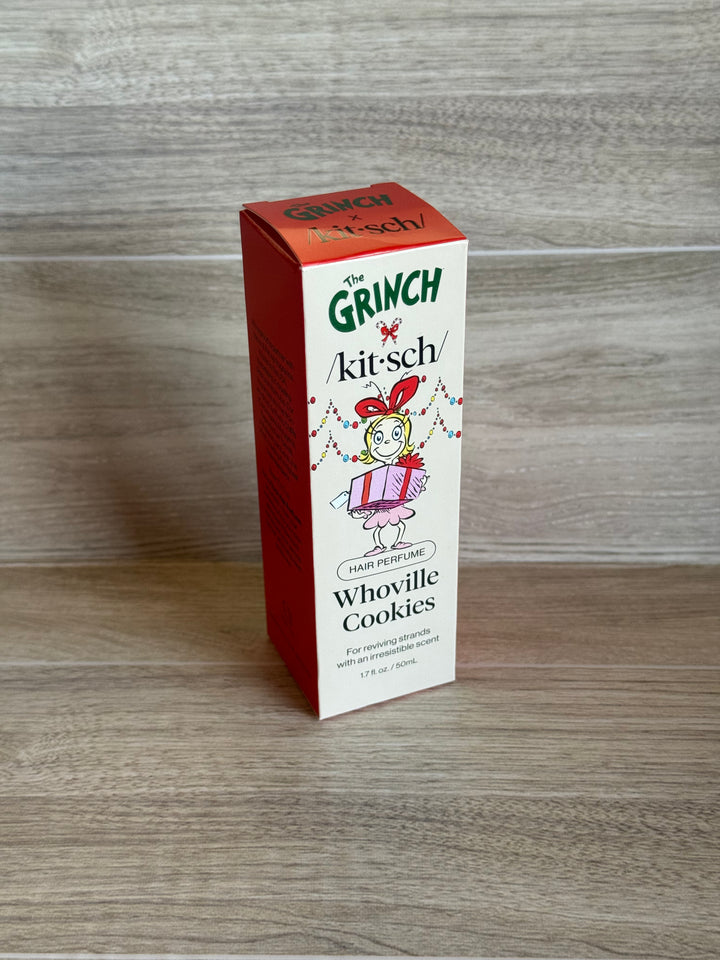 Box of Grinch-themed Whoville Cookies hair perfume on a wooden surface